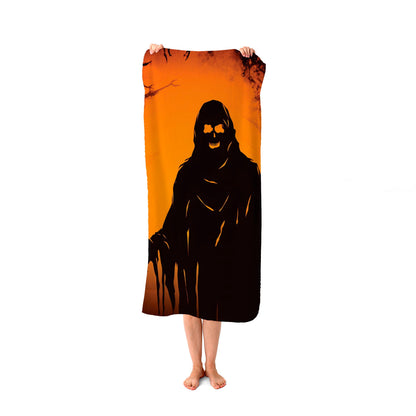 A Spooky Black And Orange Ghost Beach Towel